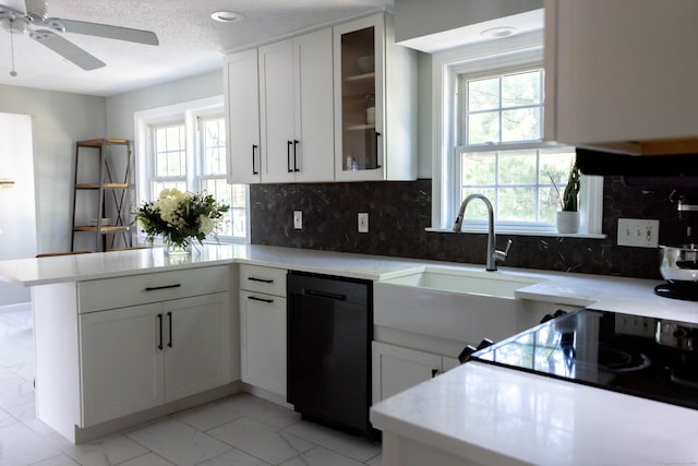 65 Lufkin Ln, Bristol, CT 06010 - kitchen featuring dishwasher, light marble finish floors, a peninsula, a sink, and ceiling fan