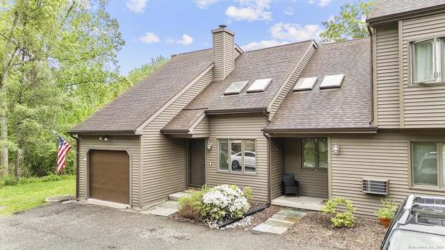 48 Twin Oaks Unit 48, New Milford, CT 06776 - view of front facade featuring a shingled roof, an attached garage, a chimney, and driveway
