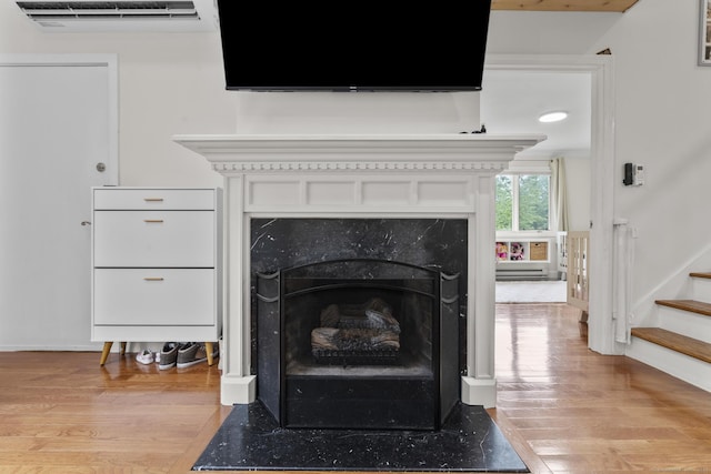 48 Twin Oaks Unit 48, New Milford, CT 06776 - detailed view of wood finished floors and a fireplace