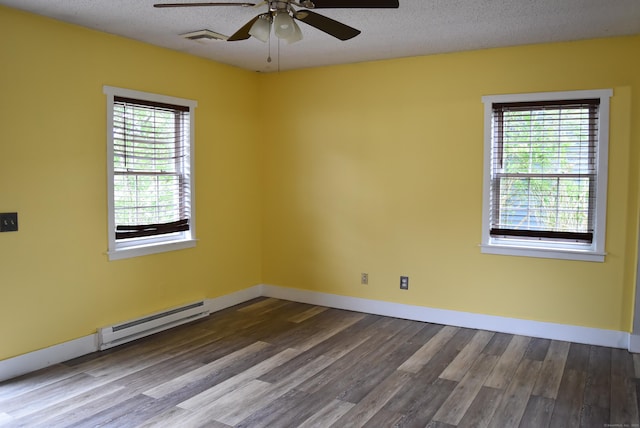 34 Joliet Ct, Groton, CT 06340 - unfurnished room with a baseboard heating unit, wood finished floors, a ceiling fan, plenty of natural light, and a textured ceiling