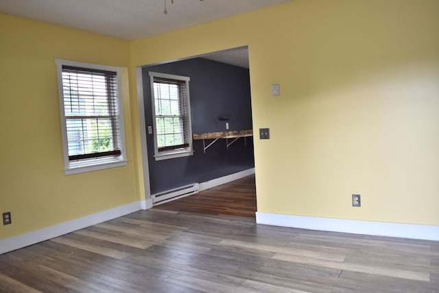 34 Joliet Ct, Groton, CT 06340 - empty room featuring baseboard heating, wood finished floors, baseboards, and a ceiling fan