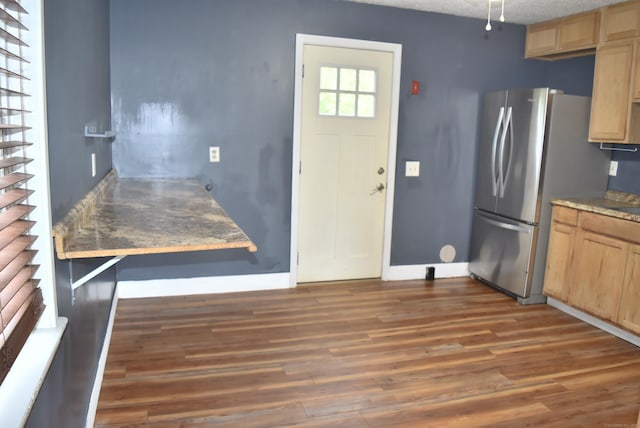 34 Joliet Ct, Groton, CT 06340 - kitchen with light brown cabinetry, wood finished floors, freestanding refrigerator, and a textured ceiling
