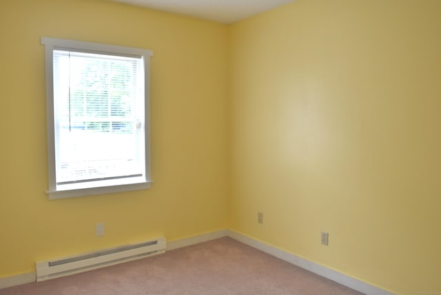 34 Joliet Ct, Groton, CT 06340 - unfurnished room featuring baseboard heating, healthy amount of natural light, light colored carpet, and baseboards