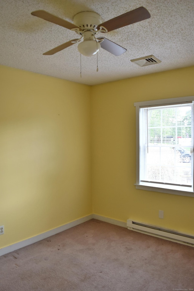 34 Joliet Ct, Groton, CT 06340 - empty room with a baseboard heating unit, light carpet, a ceiling fan, baseboards, and a textured ceiling