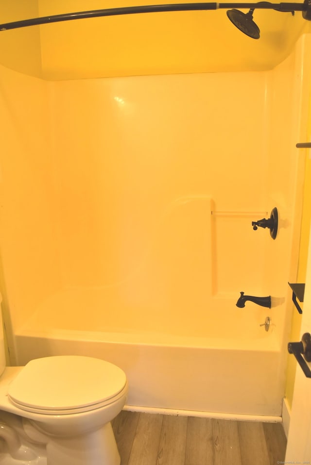 34 Joliet Ct, Groton, CT 06340 - full bathroom with wood finished floors, toilet, shower / bath combination, and baseboards