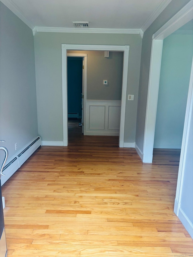 23 Dana Rd, Danbury, CT 06811 - empty room with ornamental molding, a baseboard radiator, light wood finished floors, baseboards, and a baseboard heating unit
