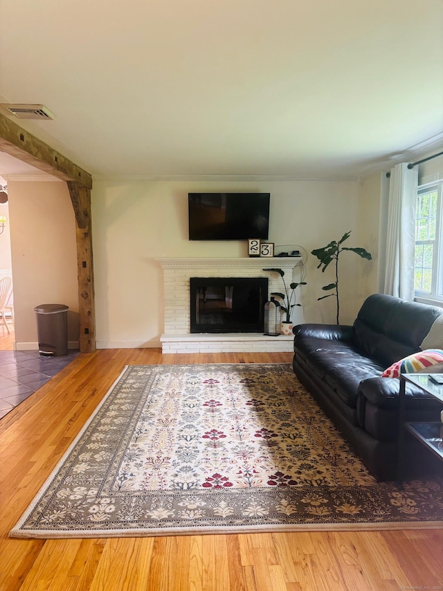 23 Dana Rd, Danbury, CT 06811 - living area featuring a glass covered fireplace and wood finished floors