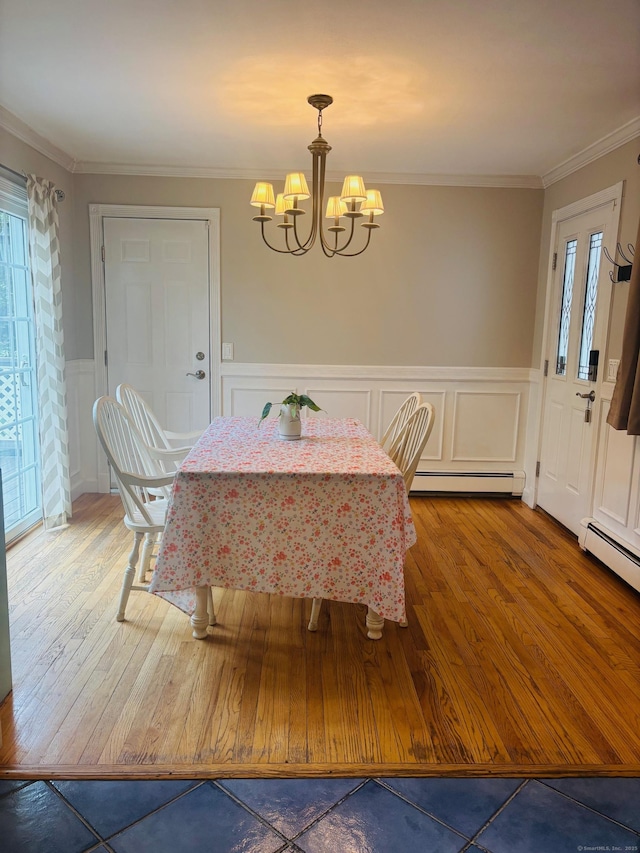 23 Dana Rd, Danbury, CT 06811 - dining space with baseboard heating, a chandelier, healthy amount of natural light, a decorative wall, and ornamental molding