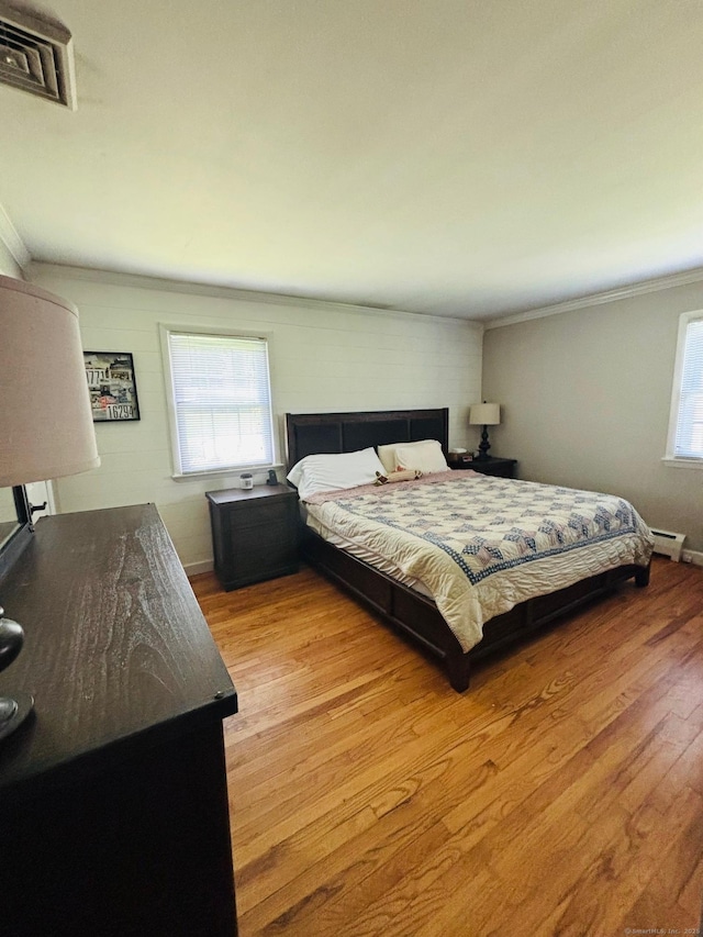 23 Dana Rd, Danbury, CT 06811 - bedroom with wood finished floors, crown molding, and a baseboard radiator