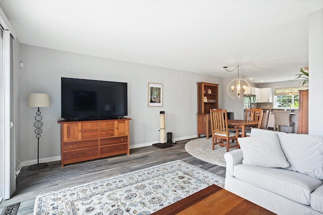 560 Silver Sands Rd Unit 902, East Haven, CT 06512 - living area with wood finished floors, a chandelier, and baseboards