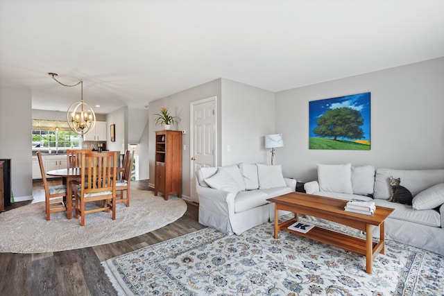 560 Silver Sands Rd Unit 902, East Haven, CT 06512 - living area featuring a chandelier, wood finished floors, and baseboards