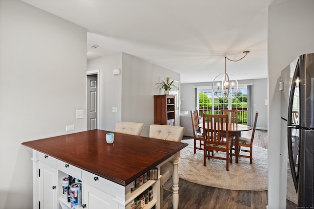 560 Silver Sands Rd Unit 902, East Haven, CT 06512 - dining area with dark wood-style flooring and a chandelier