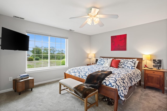560 Silver Sands Rd Unit 902, East Haven, CT 06512 - bedroom with baseboards, light carpet, and ceiling fan