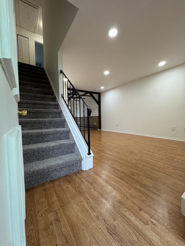 103 Kohanza St Unit E, Danbury, CT 06811 - stairs featuring wood finished floors, attic access, recessed lighting, and baseboards