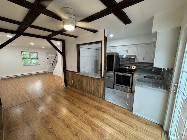 103 Kohanza St Unit E, Danbury, CT 06811 - kitchen featuring appliances with stainless steel finishes, a baseboard radiator, open floor plan, under cabinet range hood, and backsplash