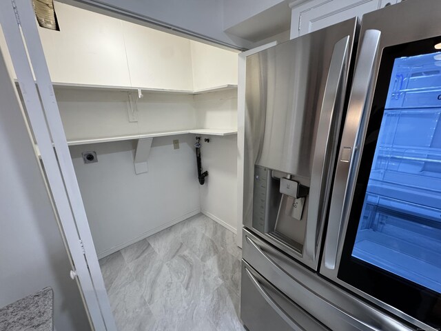 103 Kohanza St Unit E, Danbury, CT 06811 - washroom with hookup for an electric dryer, light marble finish flooring, and baseboards