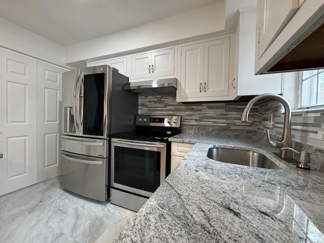 103 Kohanza St Unit E, Danbury, CT 06811 - kitchen with appliances with stainless steel finishes, ventilation hood, a sink, white cabinets, and light stone counters