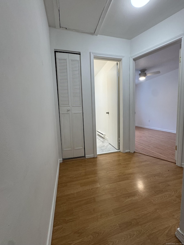 103 Kohanza St Unit E, Danbury, CT 06811 - hall featuring wood finished floors, a baseboard radiator, and baseboards
