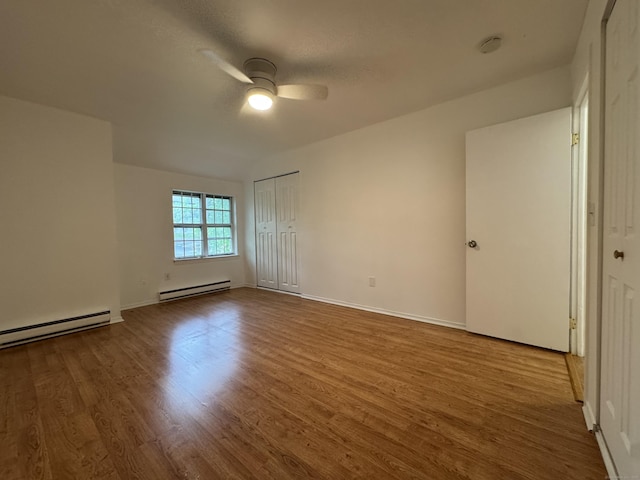 103 Kohanza St Unit E, Danbury, CT 06811 - unfurnished room featuring a baseboard radiator, a ceiling fan, and wood finished floors