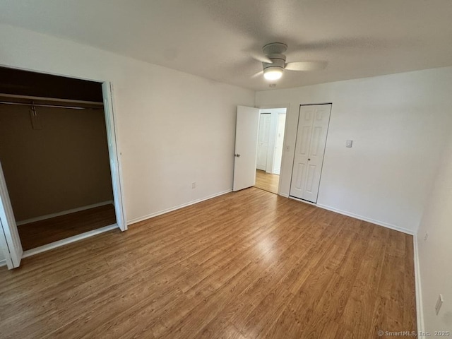 103 Kohanza St Unit E, Danbury, CT 06811 - unfurnished bedroom featuring wood finished floors, baseboards, and ceiling fan