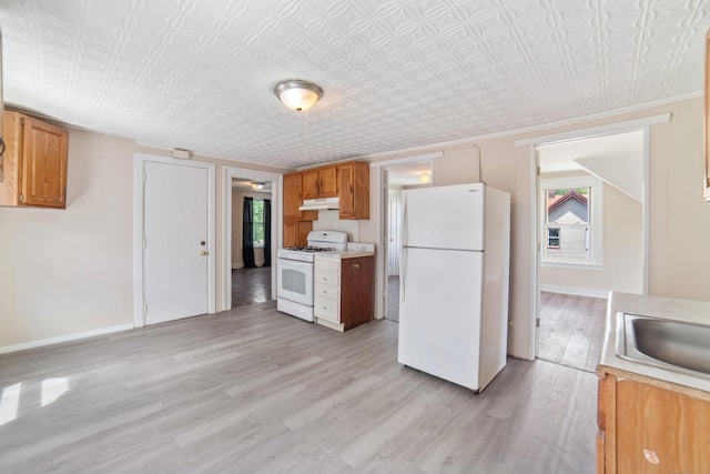 4 Granite St, Waterbury, CT 06706 - kitchen with white appliances, under cabinet range hood, light wood finished floors, light countertops, and an ornate ceiling