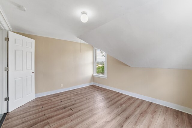 4 Granite St, Waterbury, CT 06706 - additional living space with lofted ceiling, light wood-style floors, and baseboards