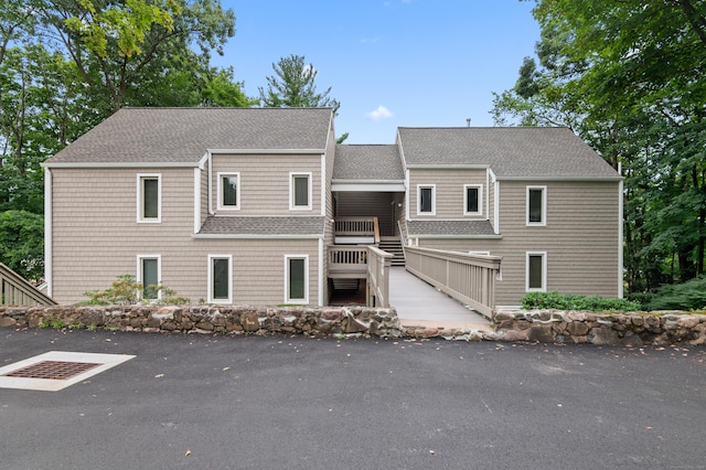 view of front of property featuring roof with shingles