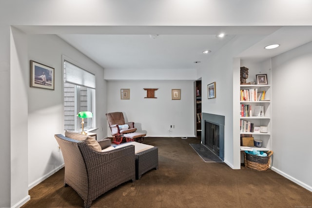 living room featuring a fireplace, carpet, baseboards, and recessed lighting