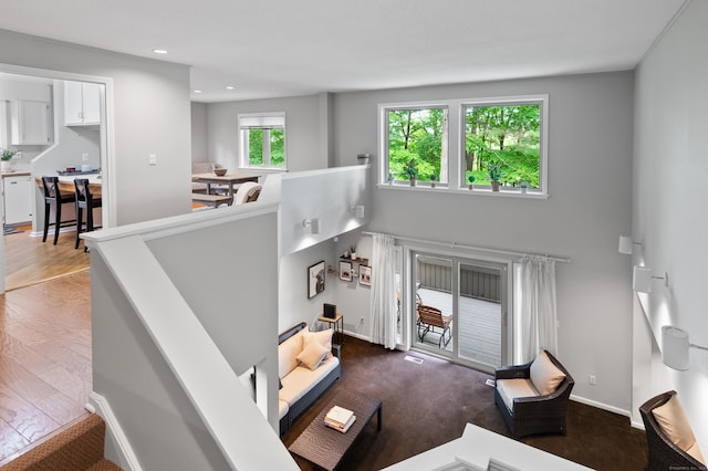 living room with recessed lighting and baseboards