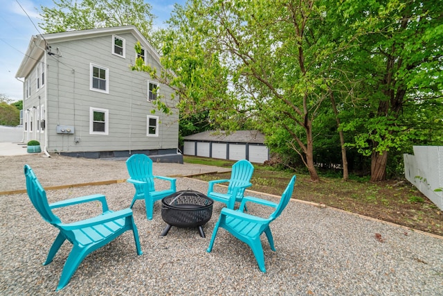 253 N Main St, Norwich, CT 06360 - view of patio featuring a fire pit and an outbuilding