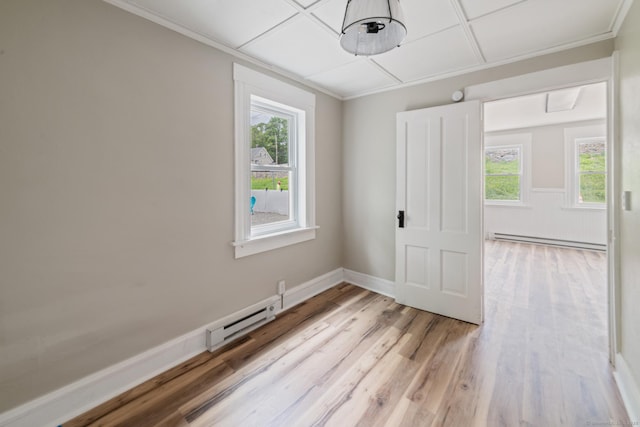 253 N Main St, Norwich, CT 06360 - unfurnished room featuring baseboard heating, healthy amount of natural light, light wood-style flooring, and ornamental molding