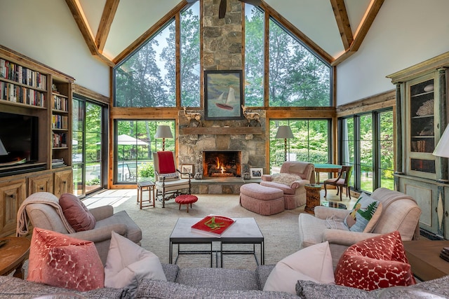 8 Heritage Island Rd, New Fairfield, CT 06812 - living room with high vaulted ceiling, a fireplace, carpet flooring, and beam ceiling