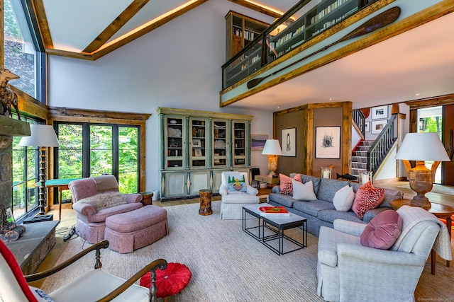 8 Heritage Island Rd, New Fairfield, CT 06812 - living area featuring high vaulted ceiling, stairs, and beam ceiling