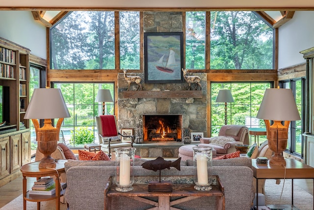 8 Heritage Island Rd, New Fairfield, CT 06812 - living room featuring a fireplace, wood finished floors, and a high ceiling