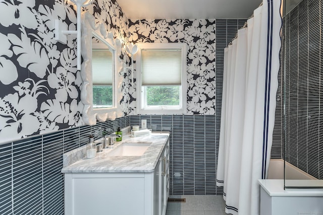 8 Heritage Island Rd, New Fairfield, CT 06812 - full bathroom with tile walls, double vanity, wallpapered walls, and tile patterned floors