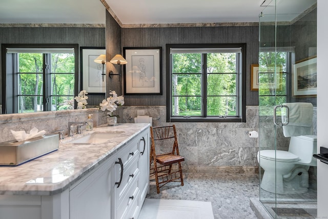 8 Heritage Island Rd, New Fairfield, CT 06812 - full bathroom with healthy amount of natural light, vanity, toilet, tile walls, and a shower with shower door