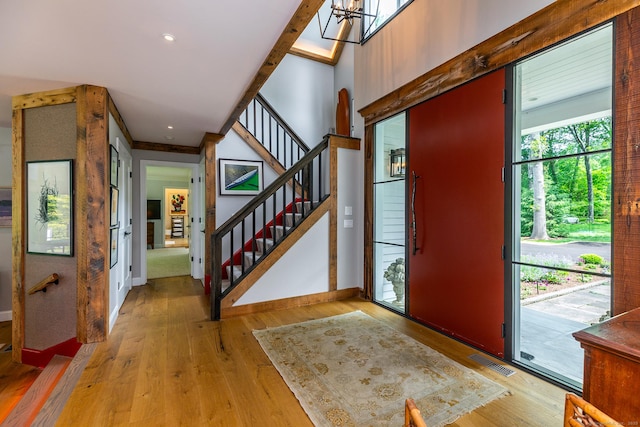 8 Heritage Island Rd, New Fairfield, CT 06812 - foyer entrance featuring stairway, wood finished floors, baseboards, and a chandelier