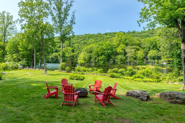 8 Heritage Island Rd, New Fairfield, CT 06812 - view of grassy yard featuring an outdoor fire pit, a water view, and a wooded view