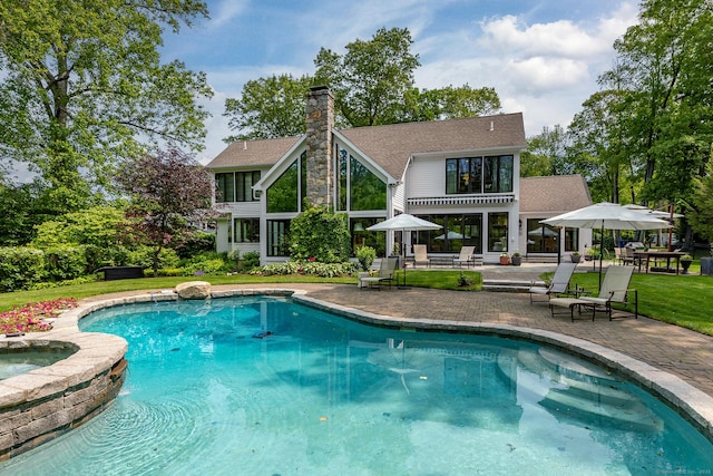 8 Heritage Island Rd, New Fairfield, CT 06812 - view of swimming pool featuring a patio, a yard, and a pool with connected hot tub