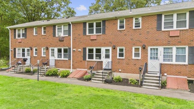 480 Radmere Rd Unit A, Cheshire, CT 06410 - rear view of house with entry steps, brick siding, and a lawn