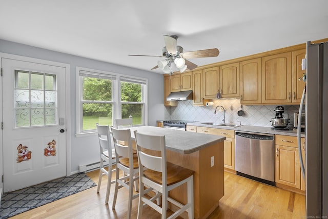 480 Radmere Rd Unit A, Cheshire, CT 06410 - kitchen featuring appliances with stainless steel finishes, a sink, under cabinet range hood, backsplash, and light wood-style flooring
