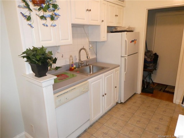 125 Prospect St Unit 3C, Stamford, CT 06901 - kitchen featuring white appliances, a sink, tasteful backsplash, white cabinets, and light countertops