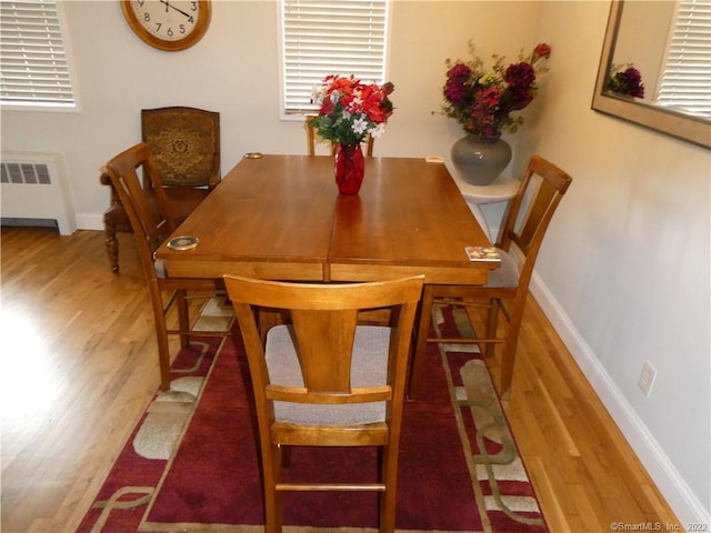 125 Prospect St Unit 3C, Stamford, CT 06901 - dining space featuring radiator, wood finished floors, and baseboards