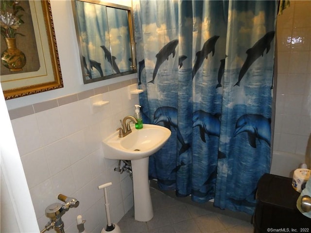125 Prospect St Unit 3C, Stamford, CT 06901 - bathroom featuring tile walls, curtained shower, and tile patterned floors