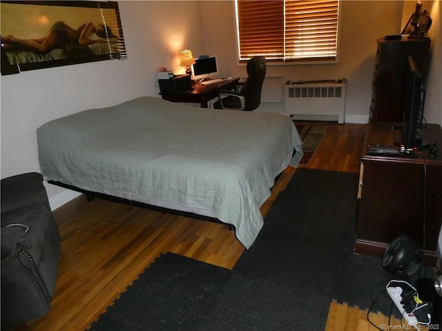 125 Prospect St Unit 3C, Stamford, CT 06901 - bedroom with radiator heating unit and wood finished floors