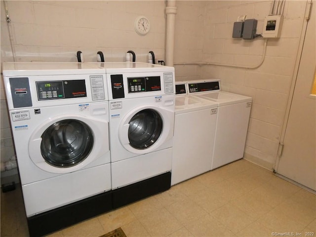 125 Prospect St Unit 3C, Stamford, CT 06901 - communal laundry room featuring independent washer and dryer, concrete block wall, and light flooring