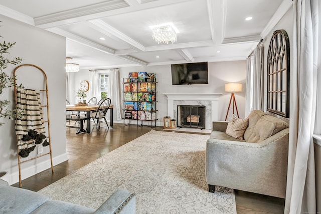 239 Bellevue Ave, West Haven, CT 06516 - living room with a chandelier, beamed ceiling, baseboards, crown molding, and a fireplace