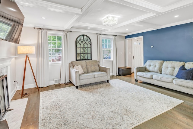 239 Bellevue Ave, West Haven, CT 06516 - living area with a chandelier, crown molding, light wood finished floors, coffered ceiling, and beamed ceiling