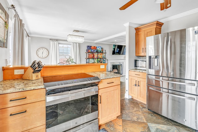 239 Bellevue Ave, West Haven, CT 06516 - kitchen featuring stainless steel appliances, crown molding, ceiling fan, light brown cabinets, and stone finish flooring