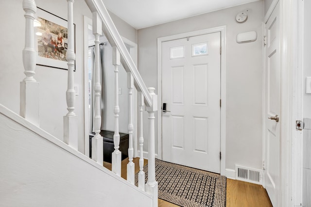 239 Bellevue Ave, West Haven, CT 06516 - foyer with wood finished floors and stairs